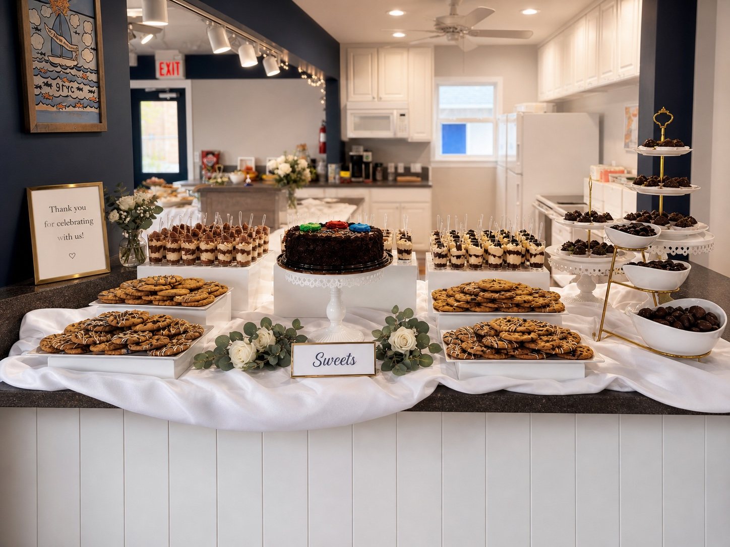 White dessert buffet with risers